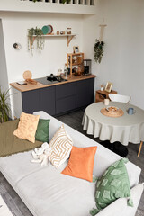 High angle view at small studio apartment interior with cozy and simple design, copy space