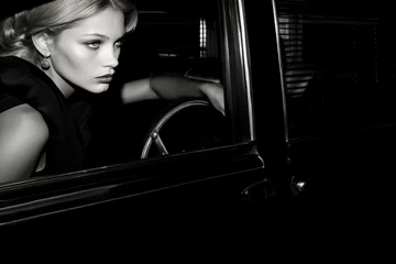 Fototapeten black and white photo of attractive female with vintage car 60's 70's style © Martin