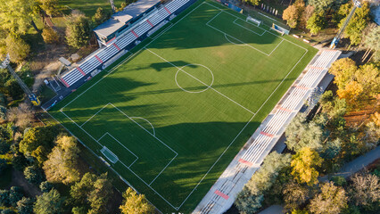Aerial top down view of football field in urban district in neighborhood area. 