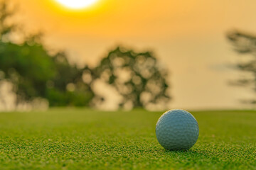 Golf ball on green grass ready to be shot at golfcourt