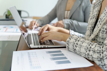 Businesswoman Accountant analyzing investment charts Invoice and pressing calculator buttons over documents. Accounting Bookkeeper Clerk&nbsp;Bank Advisor And Auditor