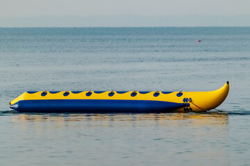 Fototapeta premium Banana boots are one of the attractions that visitors are interested in experiencing the adrenaline sensation when playing on Panrita Lopi beach.