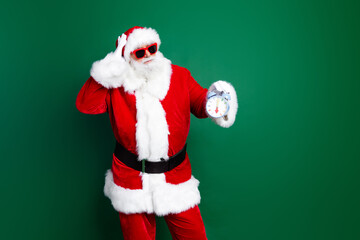 Photo of funky impressed santa dressed red costume showing new year time empty space isolated green color background