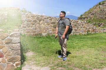 Traveler man contemplating pyramids in Mexico