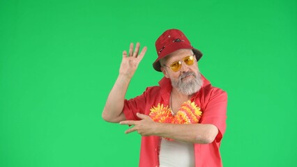 Portrait of senior man hipster on Chroma key green screen background, man posing with funny...