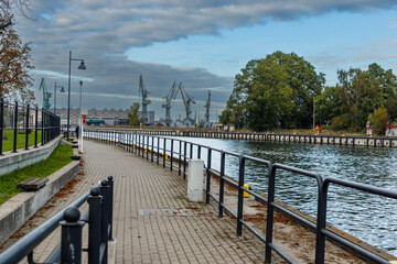 A walk along the Motława River in Gdansk with a view of the shipyard.