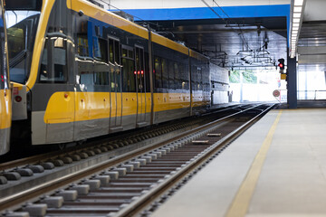 Fototapeta premium A train arriving at a bright station.