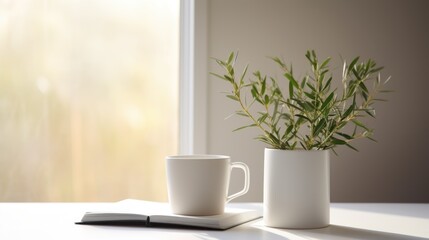 A cup of coffee and a book on a table. Simple serene setting, clean living.