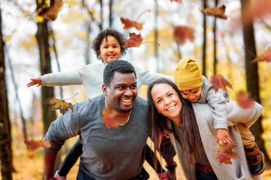 happy family playing on autumn park togerher