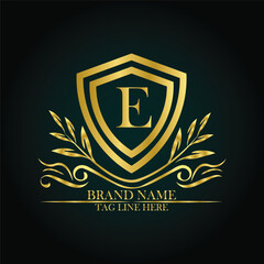 E luxury letter logo template in gold color. Elegant gold shield icon. Premium brand identity emblem. Royal coat of arms company label symbol. Modern vector Royal premium logo template vector