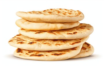 A stack of flatbreads on a white surface. Freshly baked naan bread.