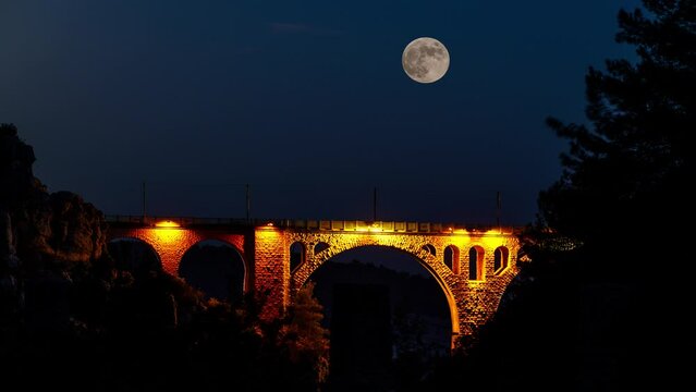 Time lapse of moonrise on railway bridge. Varda bridge  from Adana Turkey.