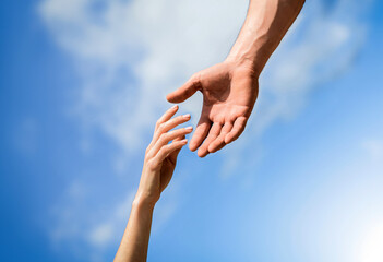 Giving a helping hand. Hands of man and woman reaching to each other, support. Rescue, helping...
