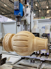 Automated production of wooden products on a turning and milling machine for furniture.