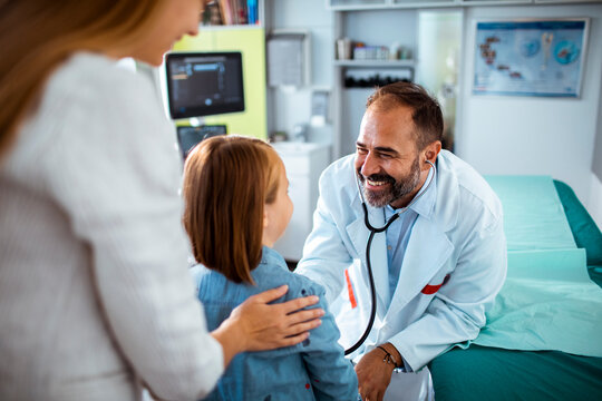 Doctor having a heartwarming interaction with a young patient
