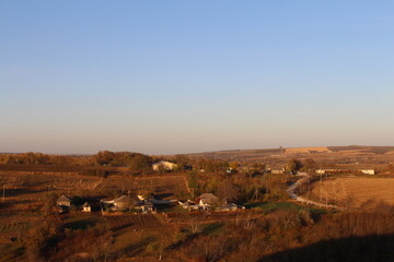 A landscape with houses and trees