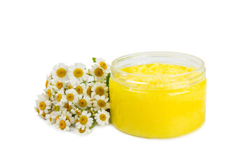 Chamomile body scrub with herbal chamomile extract isolated on white background. Skin softening scrub. Body care cosmetics, natural organic product, herbal medicine. Beauty concept. 