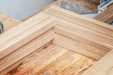Naklejka na ściany i meble Wooden frames on workbench in carpentry workshop