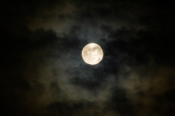 Full Moon Behind The Dark Clouds
