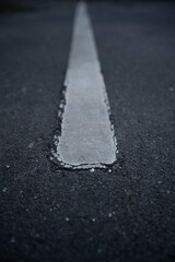 Roadstripe closeup showing cracked roadstrip.