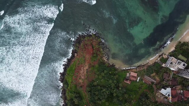 Aerial top view of Scenic Coconut tree hill in Mirissa, Sri Lanka