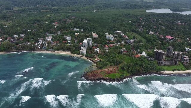 Aerial top view of Scenic Coconut tree hill in Mirissa, Sri Lanka