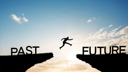 Fotobehang Conceptual business man jumping over gap between past to future © UN