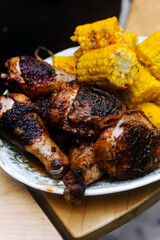 Chicken legs with grilled corn.style rustic