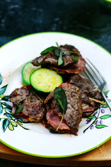 Grilled veal picatta with vegetables on the outdoor grill