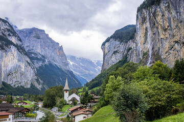 Fototapeta na wymiar Lauterbrunnen is a picturesque and enchanting Swiss village nestled in the heart of the Bernese Oberland region. 
