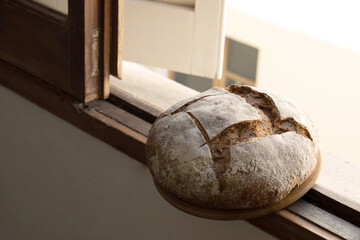 Bread, traditional sourdough bread on a rustic wooden background. Concept of traditional leavened bread baking methods. Healthy food. Copy space