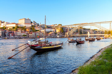 Fototapeta na wymiar Rabelo Fishing Boats with Wine Barrels,.Douro River,.Ribeira, from Vila Nova de Gaia..Porto, Oporto, Portugal, Europe
