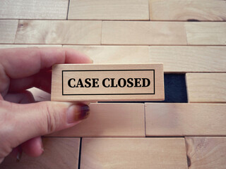 Social issues, law and justice concept. CASE CLOSED written on wooden blocks. With blurred styled...