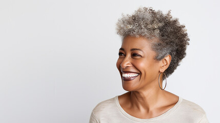 Beautiful black woman with smooth healthy facial skin. Beautiful aged mature woman with short gray hair and happy smile. Beauty and skin care cosmetics advertising concept. - obrazy, fototapety, plakaty