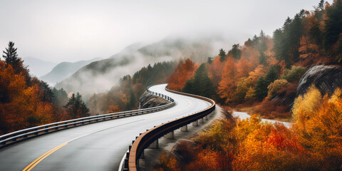 mountain highway, guardrails in view, winding through autumn foliage. Low-hanging fog, overcast...