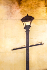 Shadow of street lamp on wall