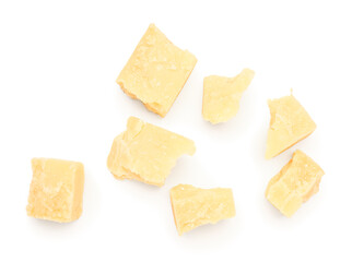 Pieces of tasty Parmesan cheese on white background