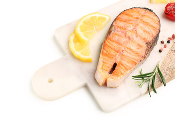 Board with tasty grilled salmon steak on white background