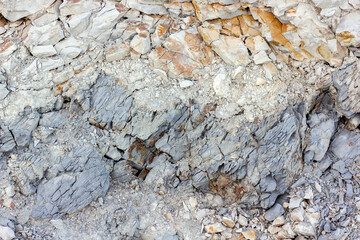 scree from the mountain on the shore stones from opoka, close-up texture