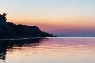 Fototapeta premium purple sunset on the river bank in summer