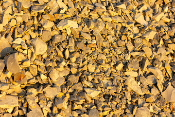 scree from the mountain on the shore stones from opoka at the golden hour, close-up texture