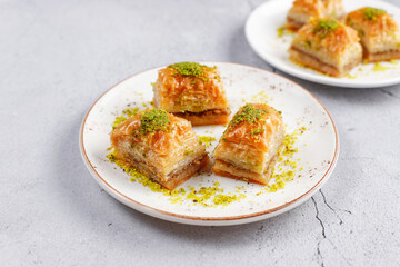 Turkish-style pistachio baklava with a glass of milk.