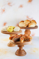 Traditional Azerbaijan holiday Novruz background with green semeni,traditional azerbaijan sweets,shekerbura,qogal,paxlava,mutaki and different nuts and sweets,top view,space for copy