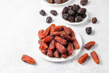 Fresh organic and various sweet dried date fruits.