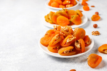 Handmade snacks from dried apricots filled with various nuts.