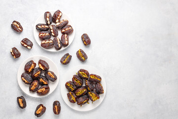 Fresh organic and various sweet dried date fruits.