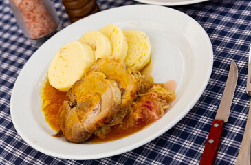 Plate of bread knodels and pork - traditional Czech cuisine