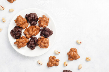 Handmade chocolate with pistachios, dark and milk chocolate pieces.
