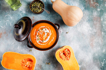 Traditional autumn butternut squash soup with seeds.