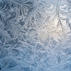 Winter frost patterns on glass. Ice crystals or cold winter background.Beautiful natural frosty pattern on winter window